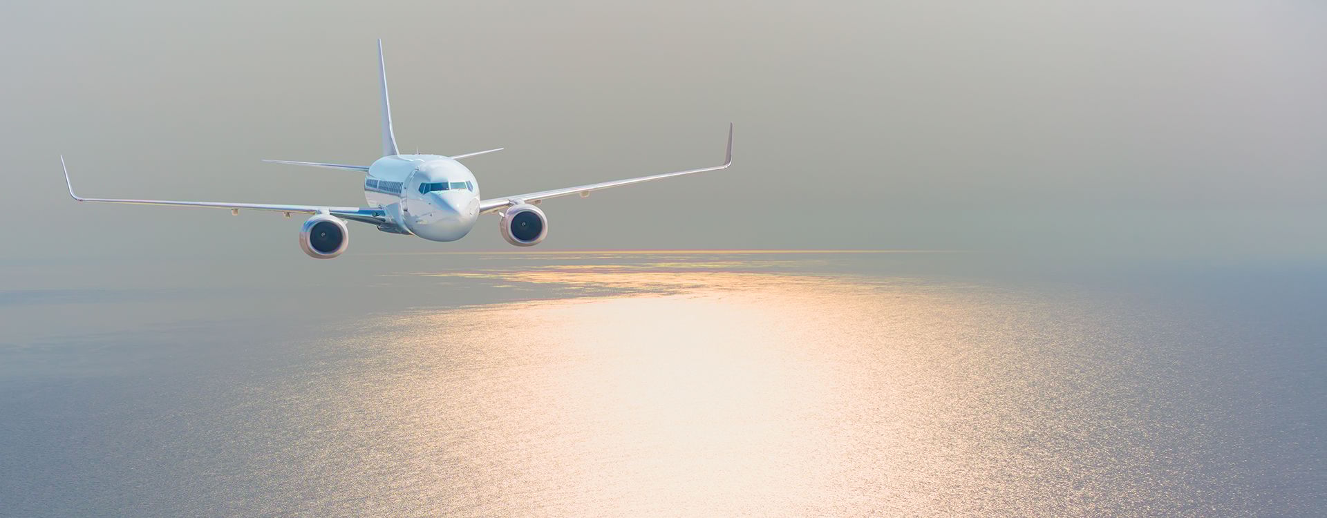 Airplane_Flying over Sunset