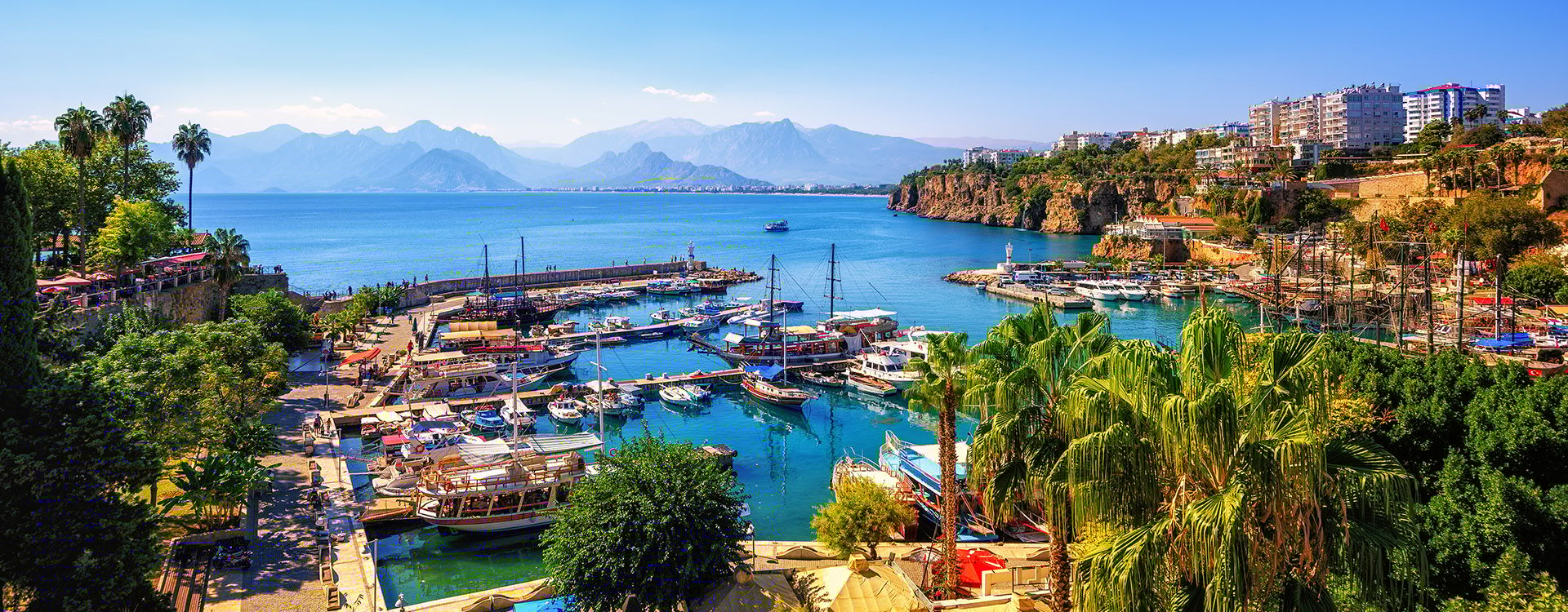 Panoramic view of Antalya Old Town port, Taurus mountains and Mediterrranean Sea, Turkey