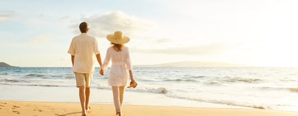 Happy Romantic Middle Aged Couple Enjoying Beautiful Sunset Walk on the Beach