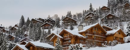 Woman at winter ski resort, Courchevel, Alps, France