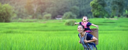 Happy Hmong women and smiling children sit outside at Giang Ta Chai village, close to Sapa town, Lao Cai province, northern Vietnam