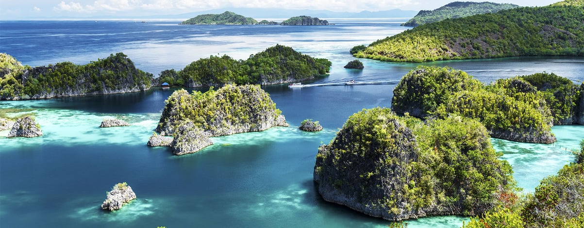 scattered islands over clear blue ocean, Painemo, Raja Ampat, West Papua