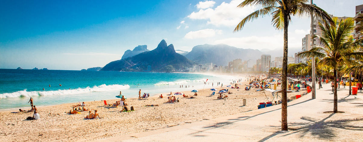 Palms and Two Brothers Mountain on Ipanema beach in Rio de Janeiro. Brazil