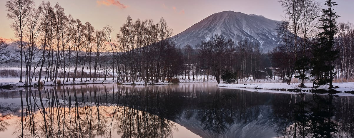 Mountain Yotei and reflective lake in Hokkaido Japanat dusk