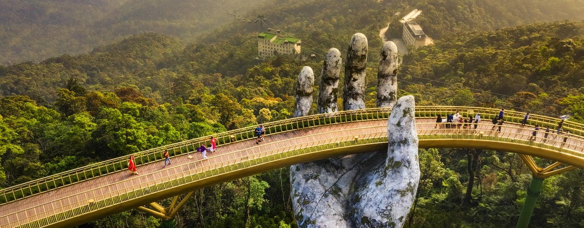 The Golden Bridge is lifted by two giant hands on Ba Na Hill in Danang, Vietnam