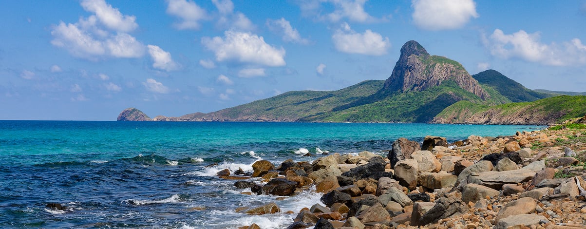 beautiful rocky beach and clear ocean in Con Dao islands, Vietnam on a clear sunny day
