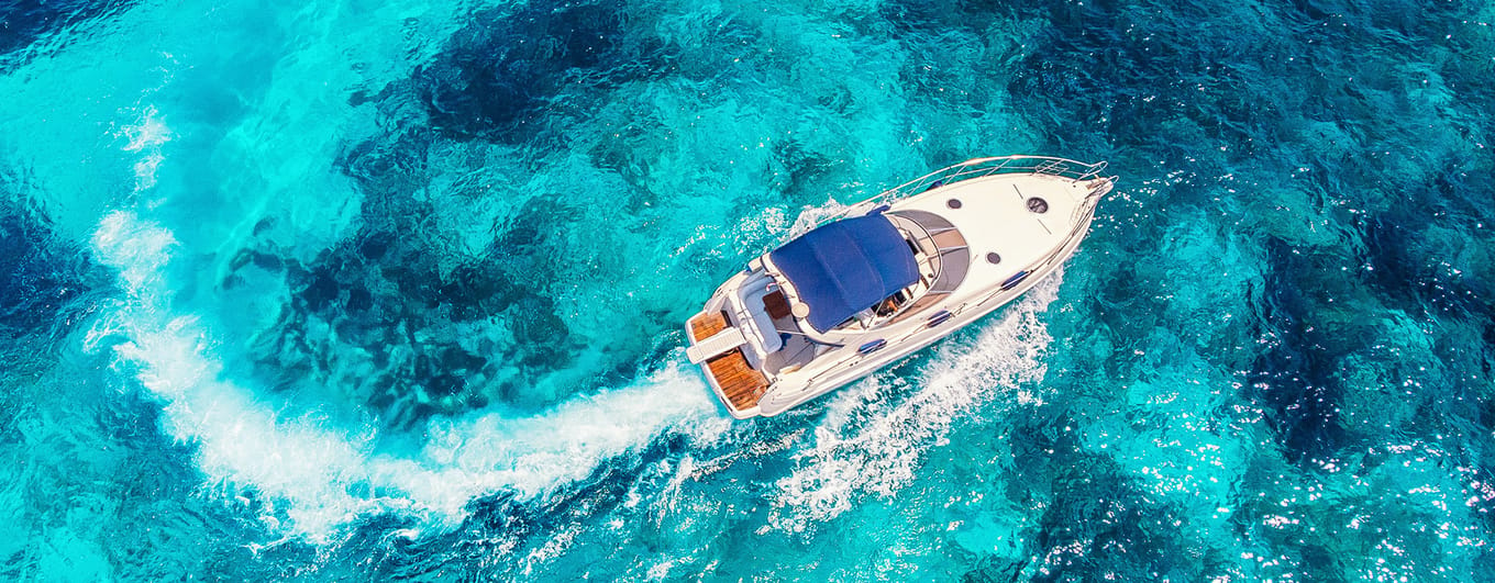 Luxury speed motor boat. Clear blue turquoise water. Aerial view.