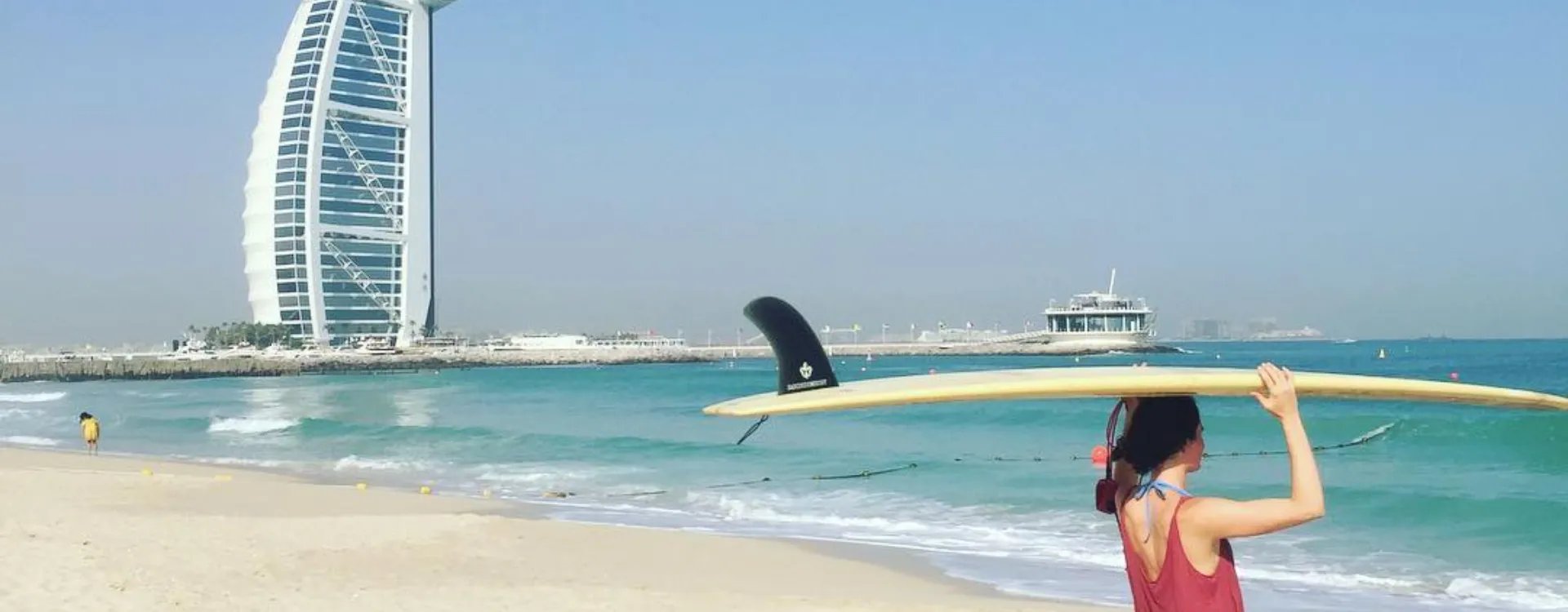 Dubai beach with surfer
