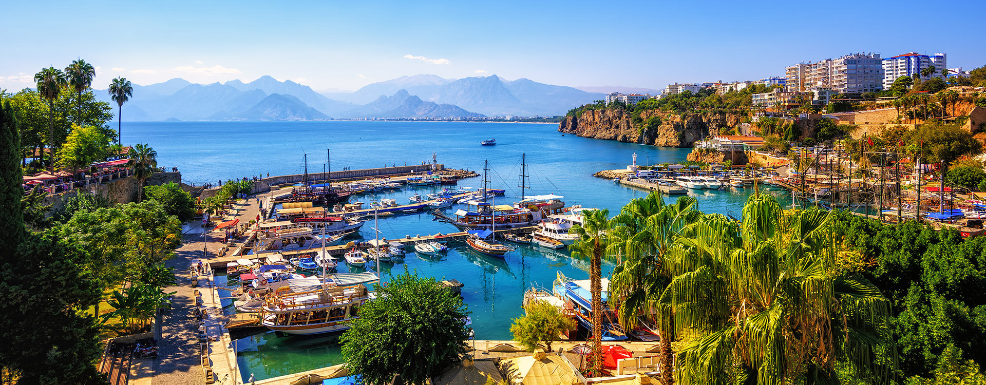 Panoramic view of Antalya Old Town port, Taurus mountains and Mediterrranean Sea, Turkey