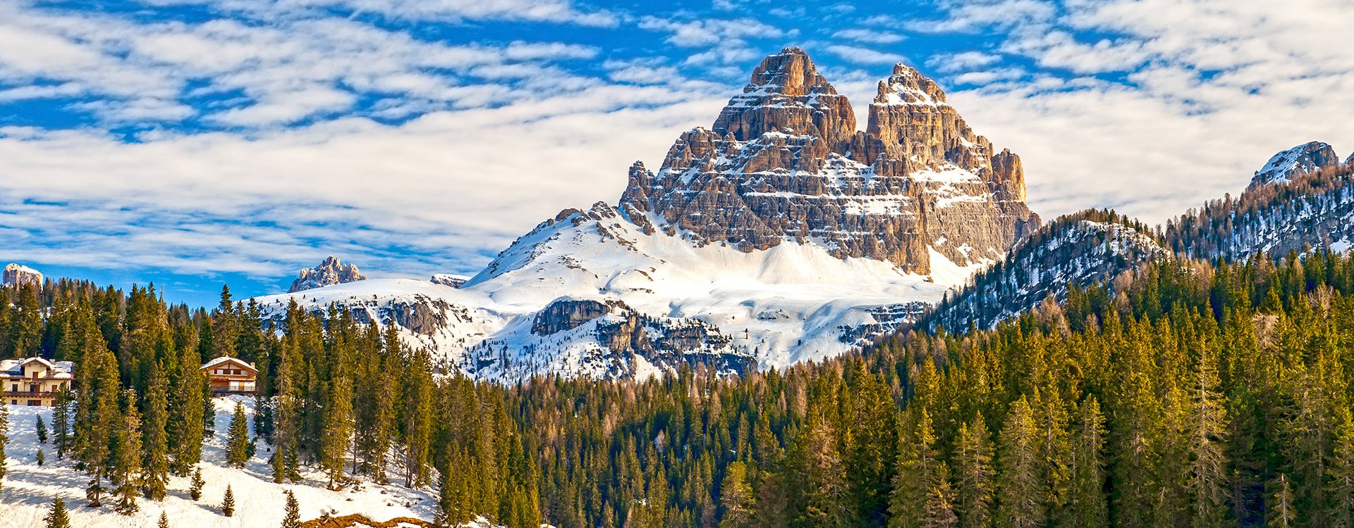 Tre Cime di Lavaredo peaks seen from Misurina lake in Dolomites, Italy