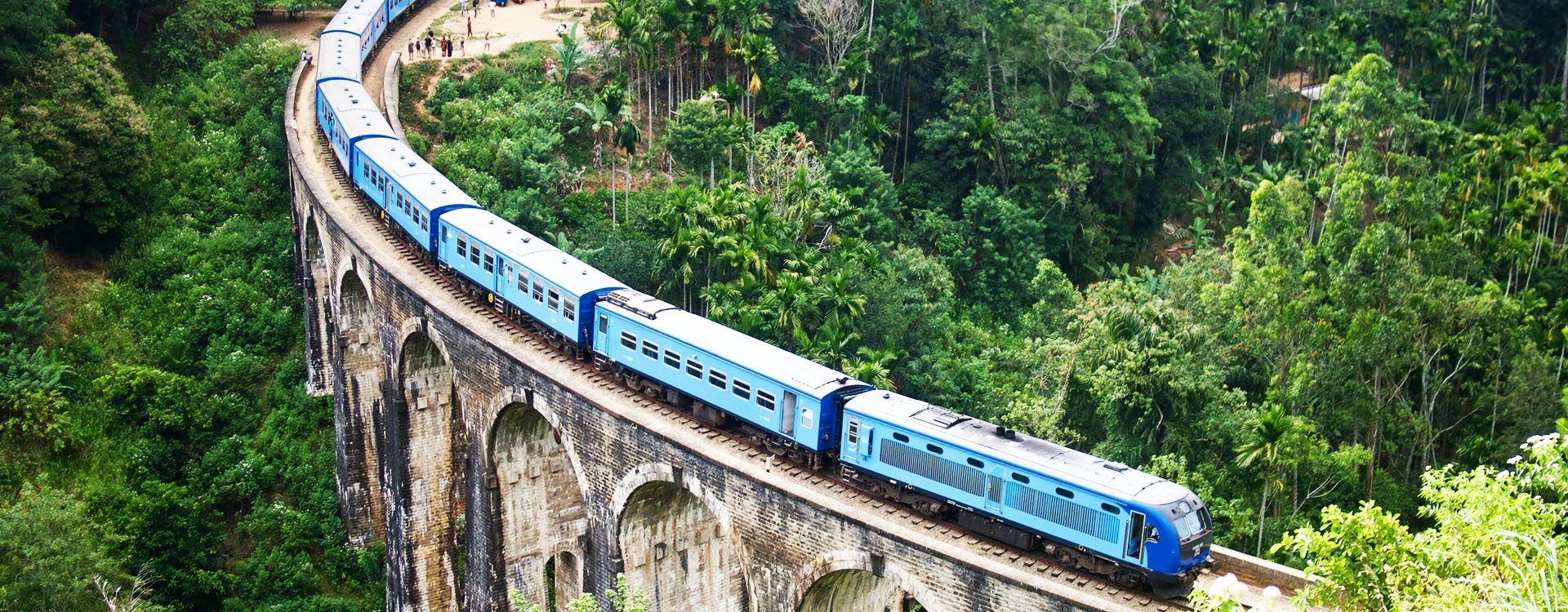 Blue passenger train in the Hill Country of Sri Laka