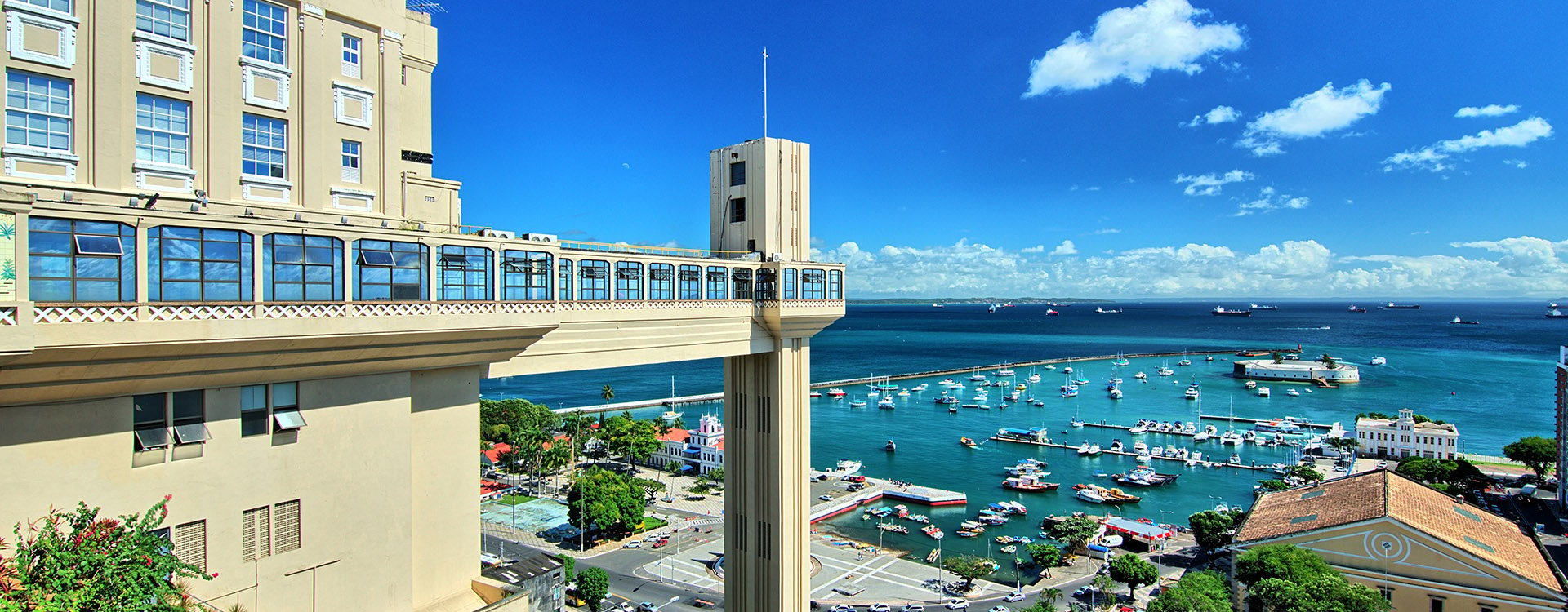 View of the Lacerda elevator and bay of all saints. Blue sky in Salvador, Bahia, Brazil. Various boats and model market