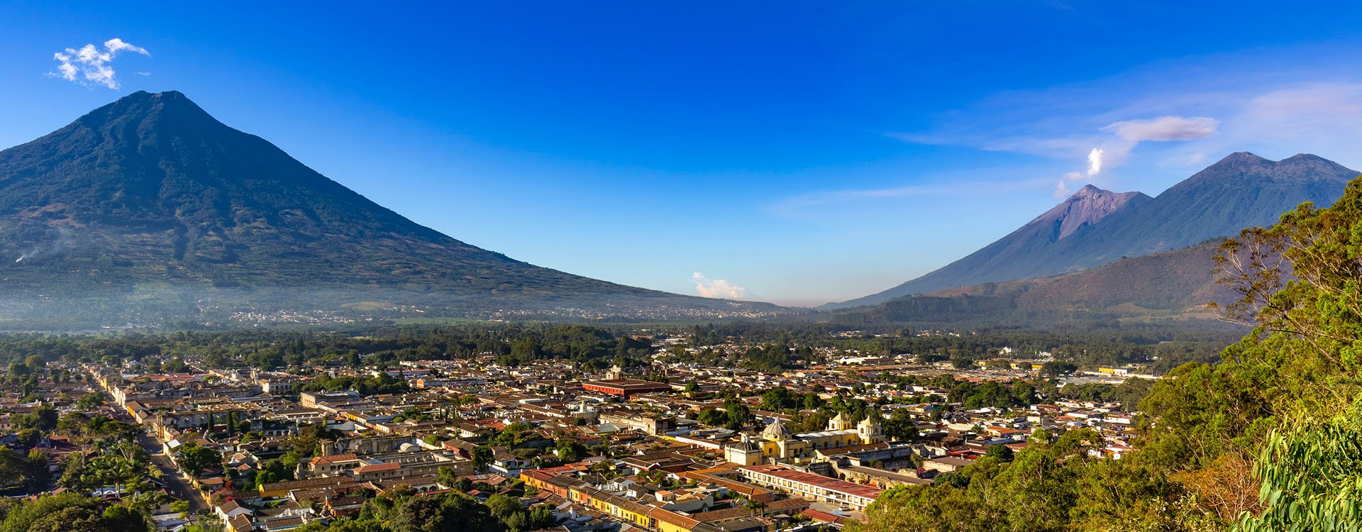 Guatemala. Antigua, surrounding volcanoes dormant Agua, smoky Fuego and Acatenango