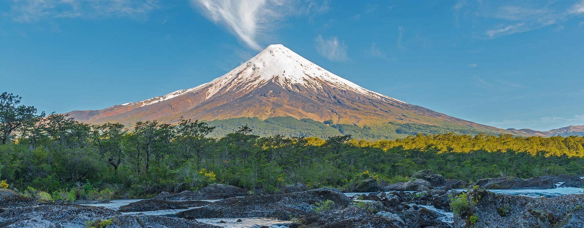 The Osorno volcano during daytime seen from the Petrohue waterfalls near Puerto Varas in South Chile