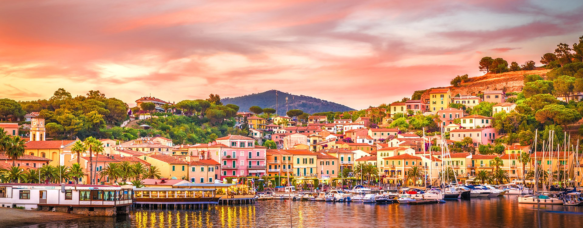 Harbor and village Porto Azzurro at sunset, Elba islands, Tuscany, Italy