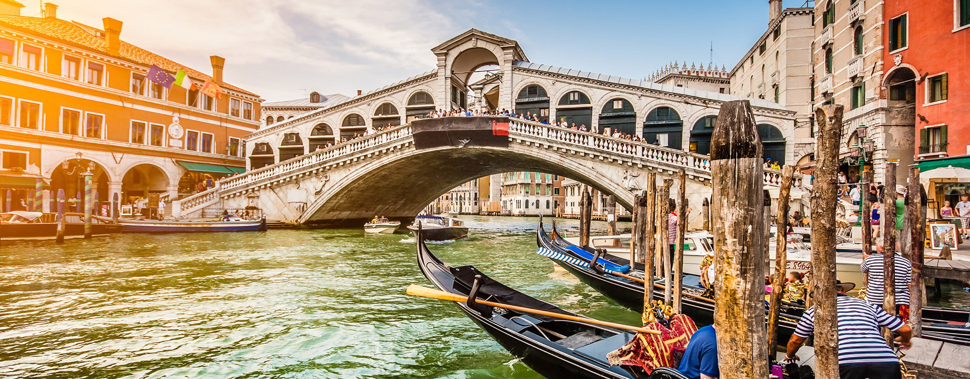 Panoramic view of famous Canal Grande from famous Rialto Bridge at sunset in Venice, Italy