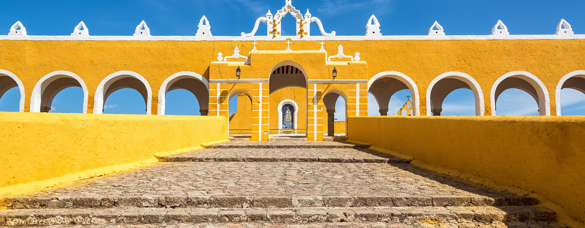Path leading up to the entrance of the colonial monastery in Izamal, Mexico