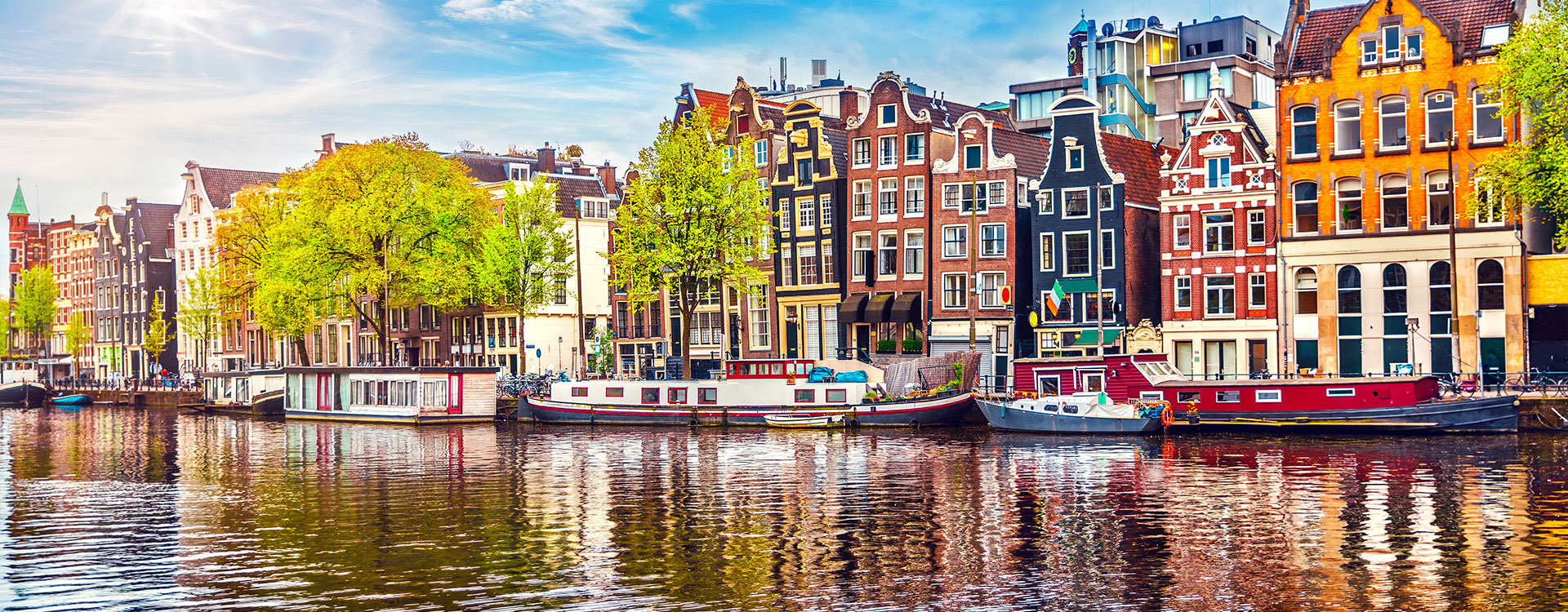 Amsterdam Netherlands dancing houses over river Amstel landmark in old european city spring landscape