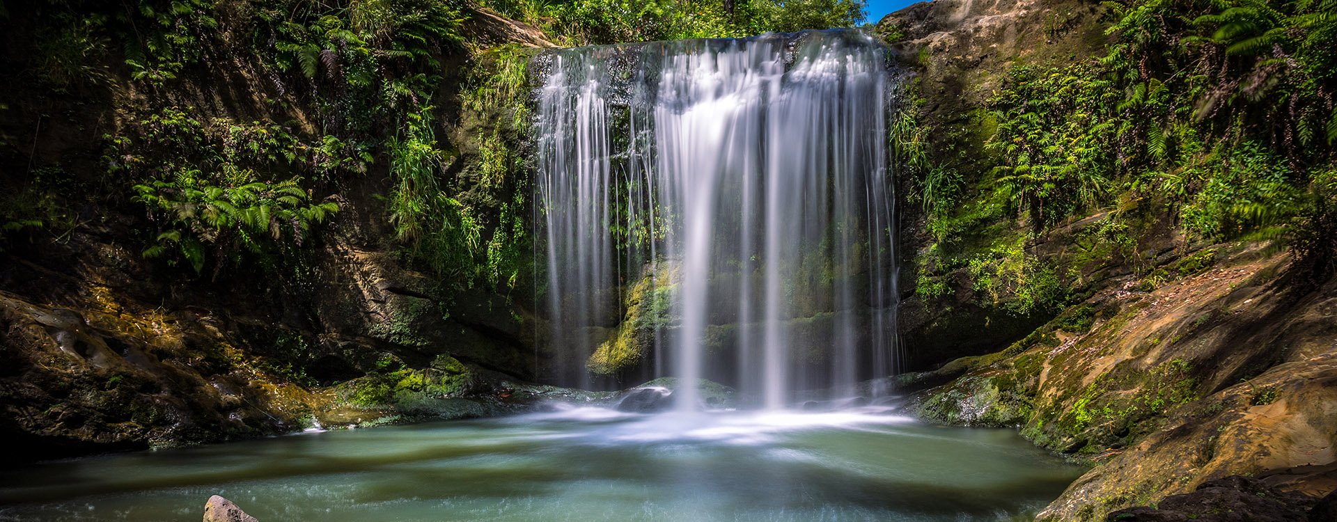 Oakley Creek Waterfall on a bright Summers Day, Auckland, New Zealand