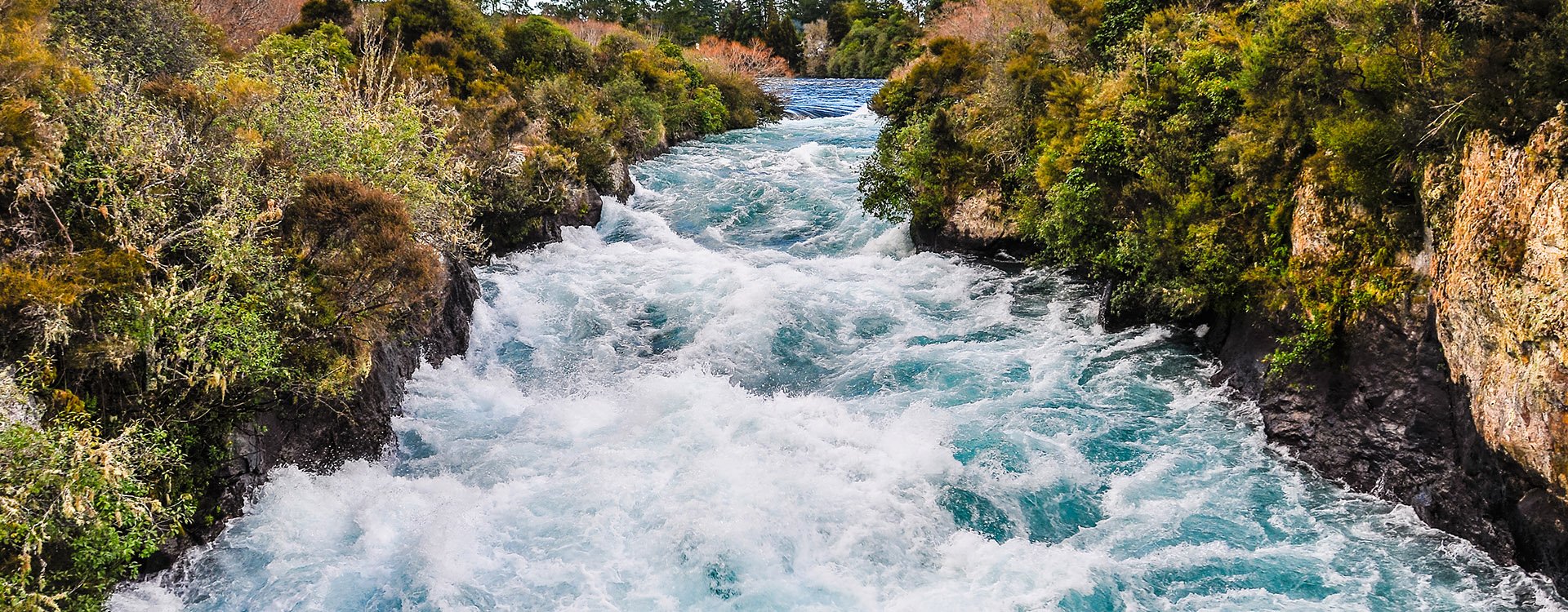 The rushing wild stream of Huka Falls near Lake Taupo, New Zealand