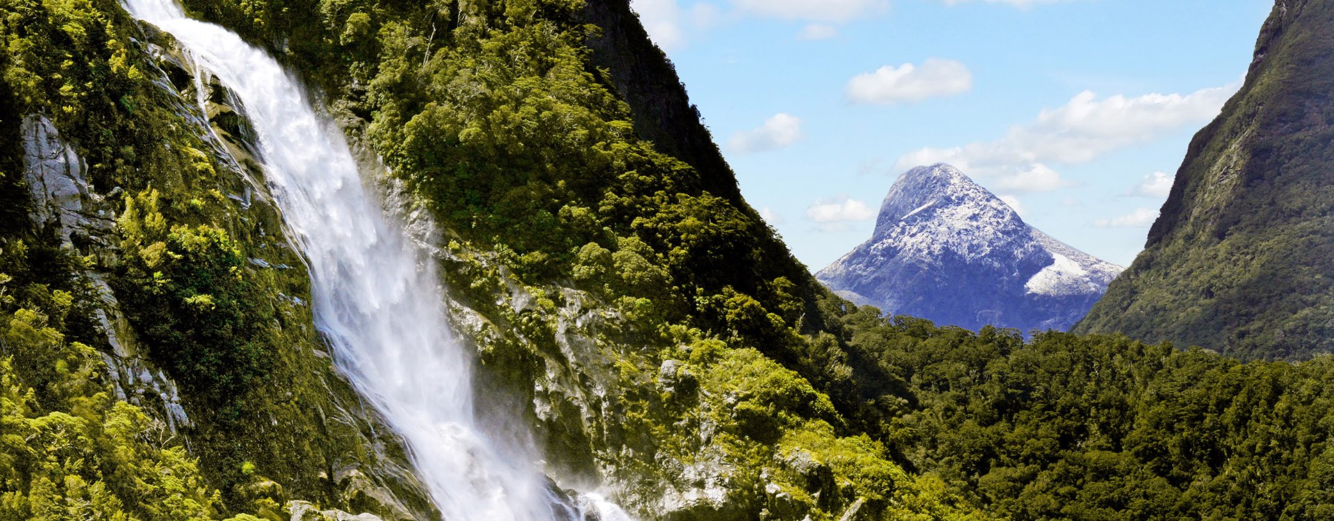 Spectacular waterfall in Milford Sound Fiordland National Park, New Zealand