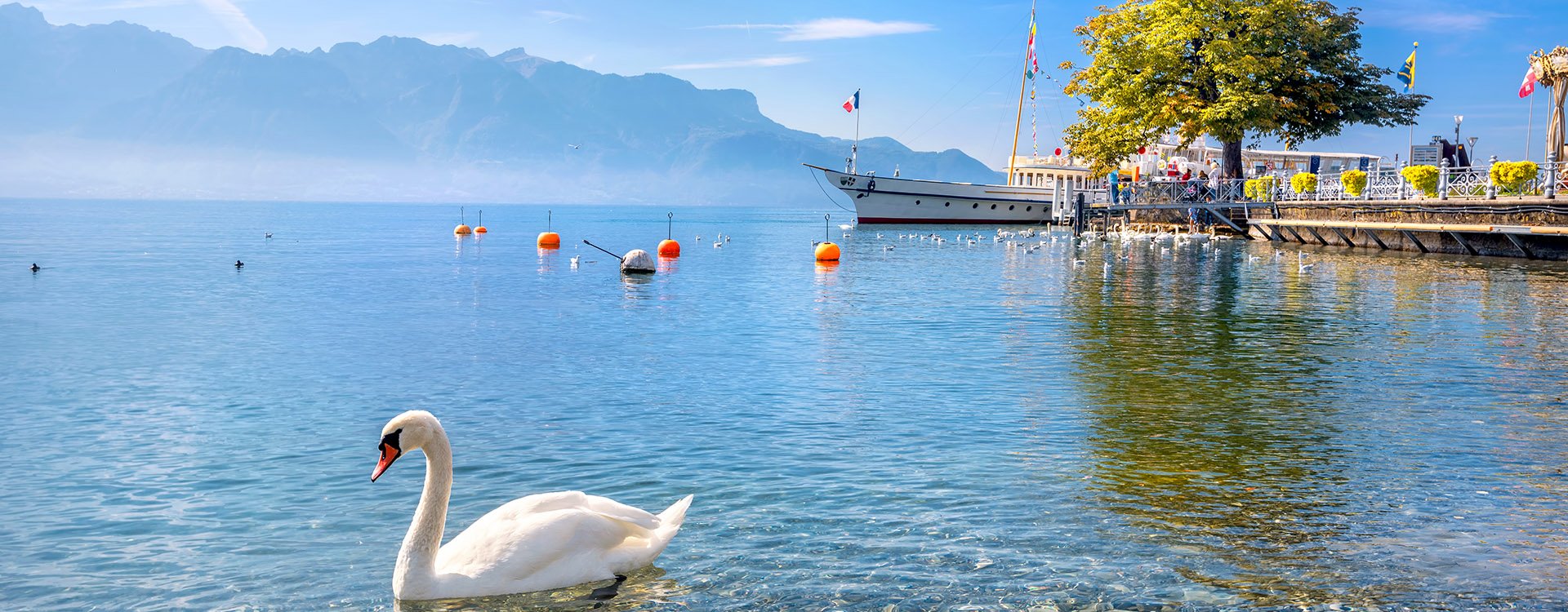 Quay with old ferry on Lake Geneva in Vevey. Vaud canton, Switzerland