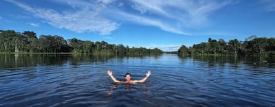 amazon-river-cruise ? Man swimming in the Amazon River in Peru