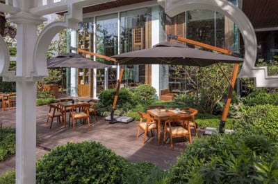 garden terrace with tables and chairs at bangkok trading post bistro and bar at137 pillars bangkok