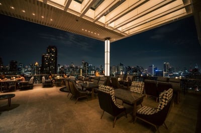 rooftop terrace with city views at nightime at 137 pillars bangkok