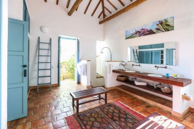 spacious bathroom with shower and twin basins