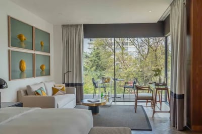 Spacious room with a balcony overlooking Lincoln Park at Casa Polanco