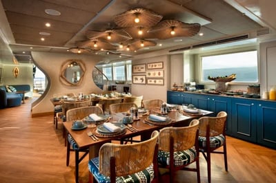 Indoor dining area on the &Beyond Galapagos Explorer Ecuador