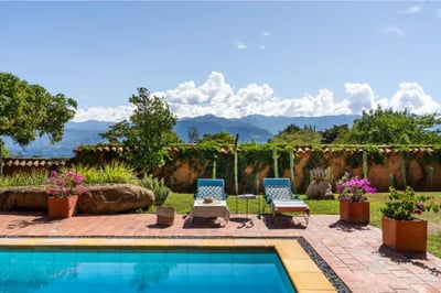 sun loungers by a pool at a colombian villa