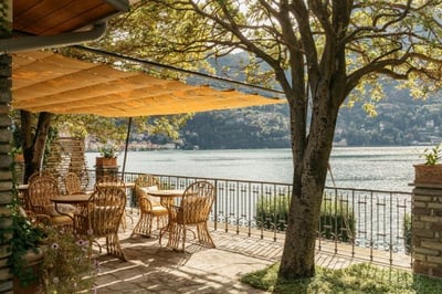 Outdoor terrace overlooking lake como at passalacqua