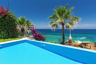 Pool with the view from Gran Presidential Spa Villa at Porto Zante, Greece