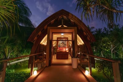 Wooden building at night at The Brando