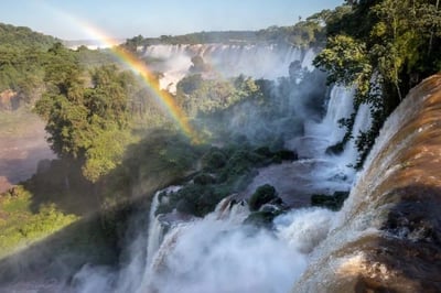 rainbow over iguazu falls