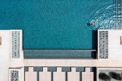 Aerial view of person swimming in the main pool