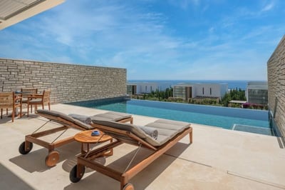 Two sun loungers next to an outdoor plunge pool