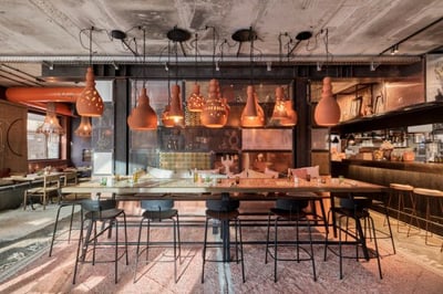 restaurant with large dining table at cervo mountain resort in zermatt