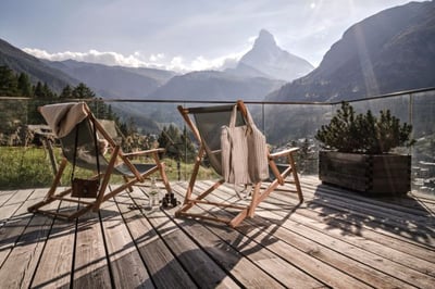 terrace at the cervo mountain resort with views of the matterhorn in summer