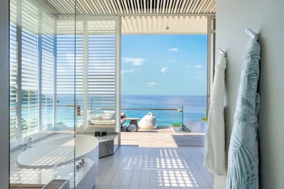 Bathroom with a sea view at Cheval Blanc Seychelles