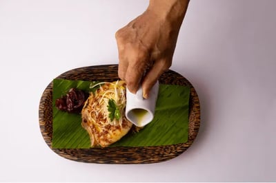 Delfn Peru luxury river cruise chef creating gourmet food