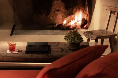 sofa infront of the fireplace at zannier le chalet