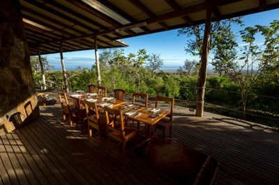 dining table overlooking the surrounding natural landscape at galapagos safari camp