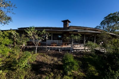 exterior view of the main lodge with outdoor terrace at galapagos safari camp
