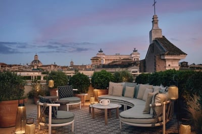 The Notos bar and terrace at night with city views