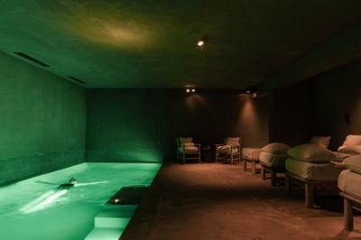 person bathing in the spa at zannier le chalet
