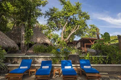 Sun chair near the pool at Jicaro Island Lodge