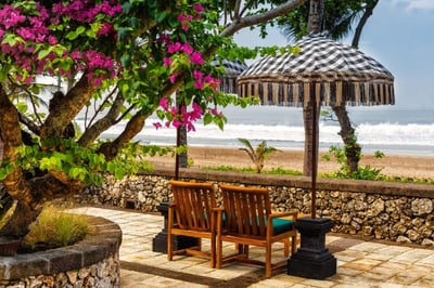 terrace overlooking the beach at the oberoi beach resort in bali